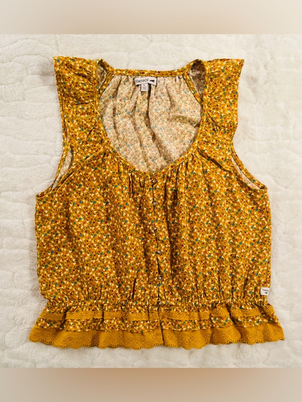 Toad&Co floral Manzana  top with a scoop neck, and delicate ruffle details. L
